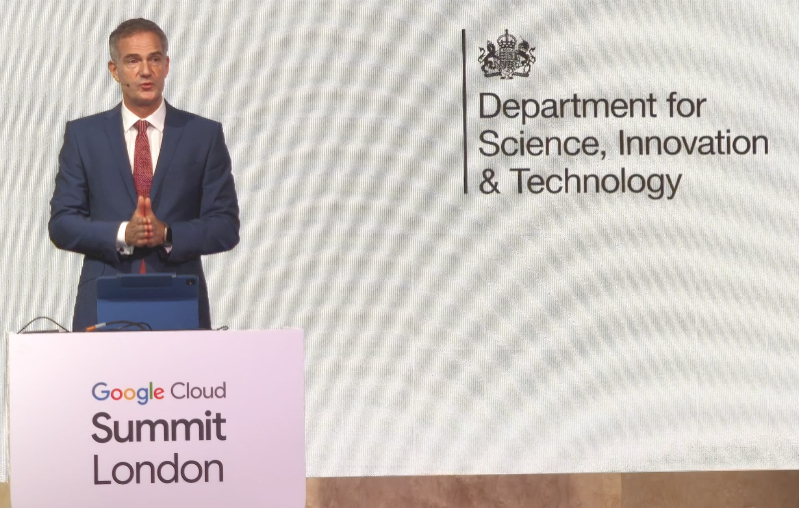 Peter Kyle, Secretary of State for Science, Innovation and Technology A man in a suit speaks on stage at the Google Cloud Summit London, with the Department for Science, Innovation & Technology logo displayed on a screen behind him.