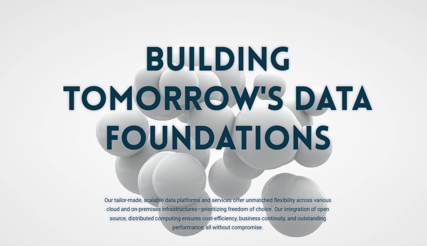 klarrio Text reading "BUILDING TOMORROW'S DATA FOUNDATIONS" appears over a background of white spheres. Smaller text below describes scalable data platforms and distributed computing benefits.