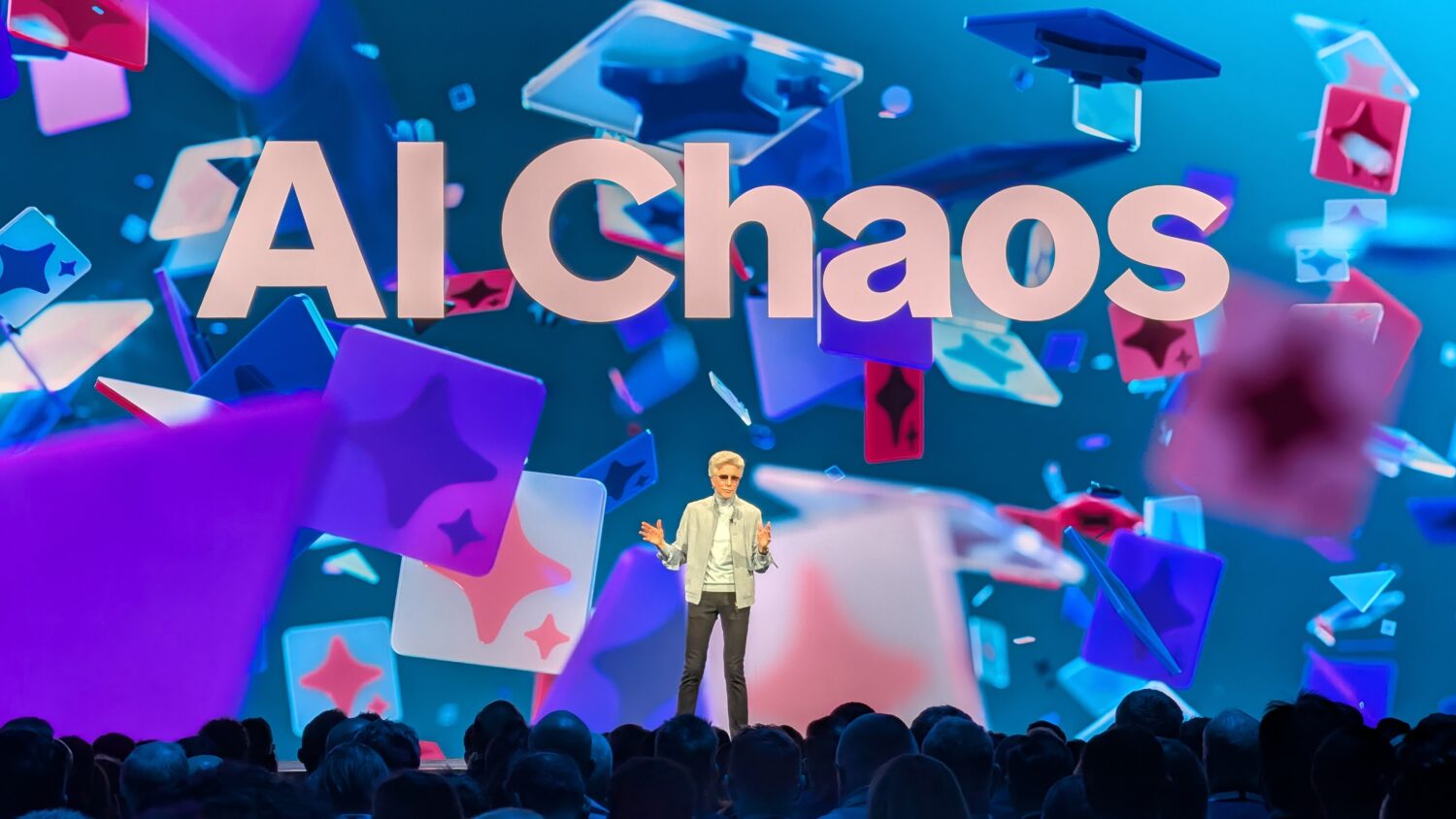 A speaker stands on stage before an audience, with "AI Chaos," colorful geometric shapes, and a ServiceNow AI kill switch icon displayed on the large screen behind them.